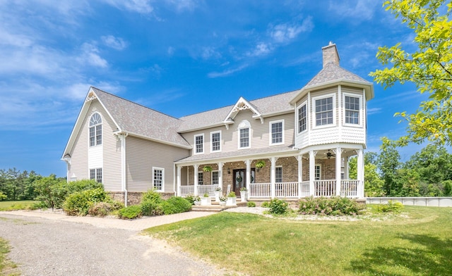 5050 Pleasant Lake Rd, Ann Arbor, MI 48103 - view of front of house featuring covered porch, a front lawn, a chimney, and stone siding