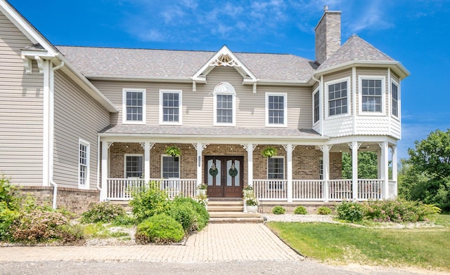 5050 Pleasant Lake Rd, Ann Arbor, MI 48103 - view of front of home featuring covered porch, a shingled roof, a chimney, and brick siding