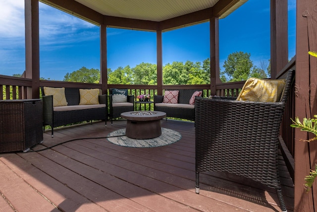 5050 Pleasant Lake Rd, Ann Arbor, MI 48103 - wooden deck with an outdoor living space with a fire pit