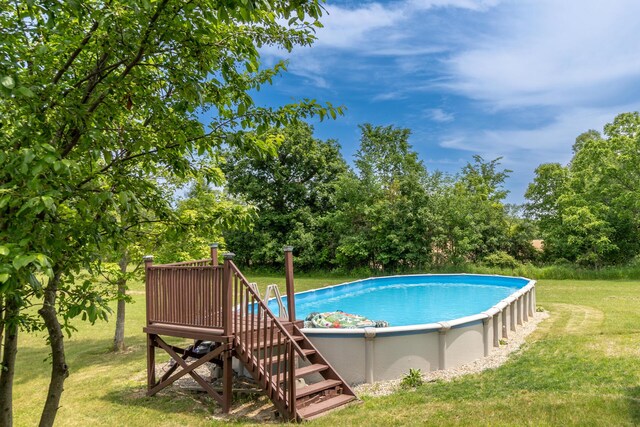 5050 Pleasant Lake Rd, Ann Arbor, MI 48103 - outdoor pool featuring a lawn and view of scattered trees