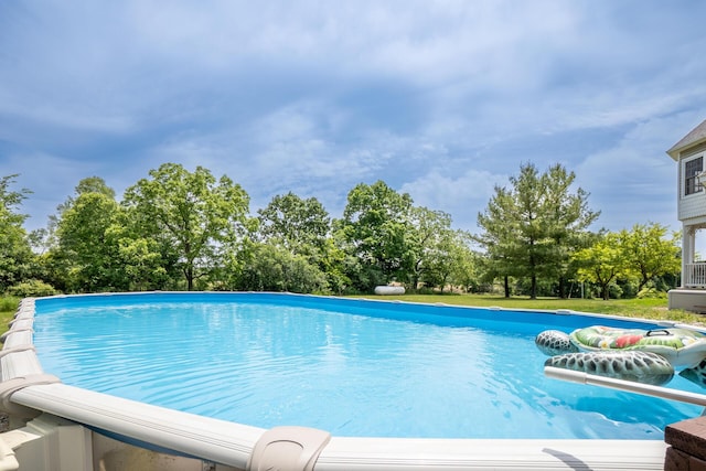 5050 Pleasant Lake Rd, Ann Arbor, MI 48103 - swimming pool with view of scattered trees