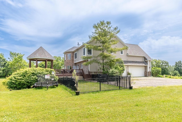5050 Pleasant Lake Rd, Ann Arbor, MI 48103 - back of house with driveway, a garage, a gazebo, and brick siding