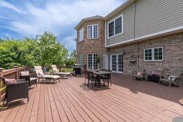 5050 Pleasant Lake Rd, Ann Arbor, MI 48103 - wooden terrace featuring outdoor dining space, grilling area, an outdoor hangout area, and french doors