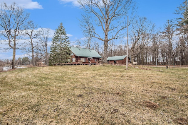 view of yard featuring an outbuilding and a deck