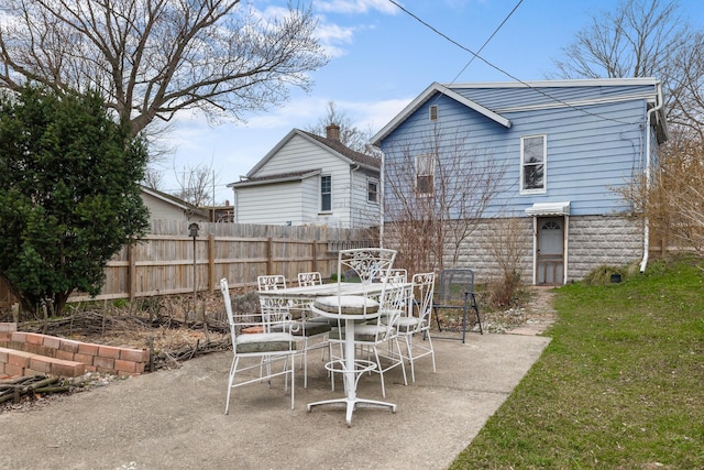 view of patio / terrace with outdoor dining area and fence
