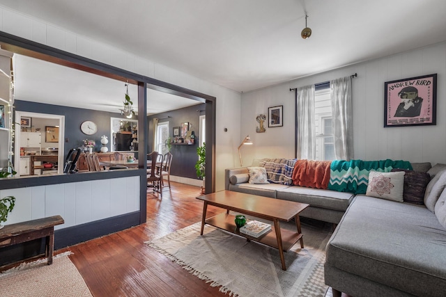 living area with a wealth of natural light and wood-type flooring