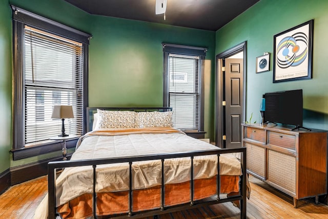 bedroom with hardwood / wood-style floors