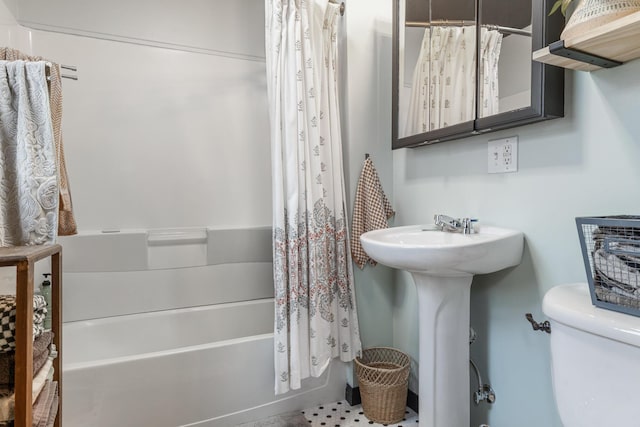 bathroom with shower / bathtub combination with curtain and toilet