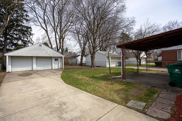 15655 Ego Ave, Eastpointe, MI 48021 - view of yard with an outbuilding, a detached garage, and fence