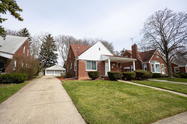 15655 Ego Ave, Eastpointe, MI 48021 - view of front of property featuring brick siding, a garage, a chimney, an outbuilding, and a front lawn