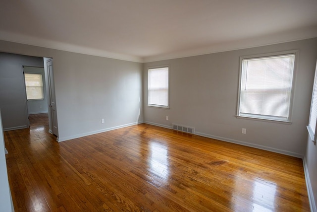 15655 Ego Ave, Eastpointe, MI 48021 - empty room with visible vents, baseboards, and hardwood / wood-style flooring