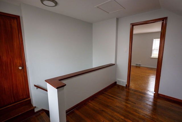 15655 Ego Ave, Eastpointe, MI 48021 - interior space with dark wood-style flooring, visible vents, baseboards, and an upstairs landing
