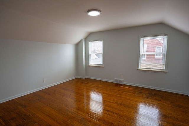 15655 Ego Ave, Eastpointe, MI 48021 - bonus room with visible vents, baseboards, hardwood / wood-style floors, and lofted ceiling