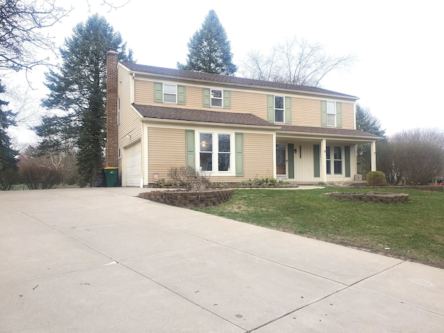 traditional-style house featuring driveway, a front yard, roof with shingles, a chimney, and an attached garage