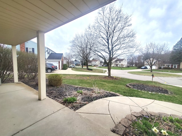 view of yard featuring a residential view