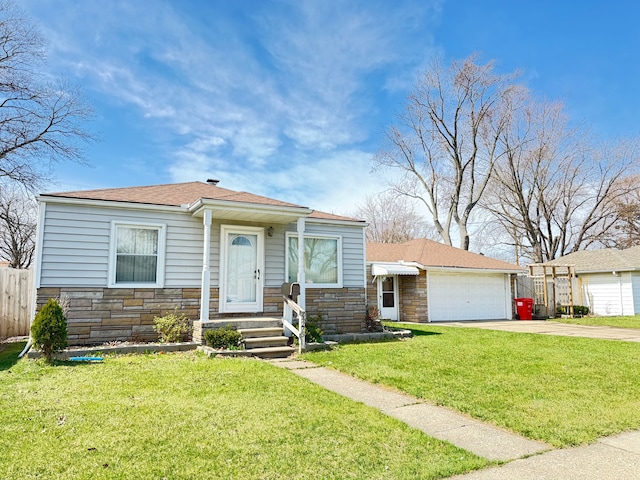24275 Valley Ave, Eastpointe, MI 48021 - view of front of home featuring stone siding, driveway, a garage, and roof with shingles