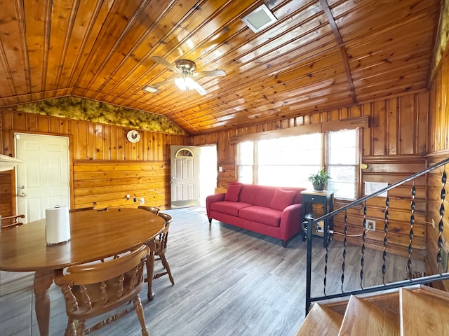 24275 Valley Ave, Eastpointe, MI 48021 - living room with vaulted ceiling, wooden walls, wooden ceiling, ceiling fan, and wood finished floors