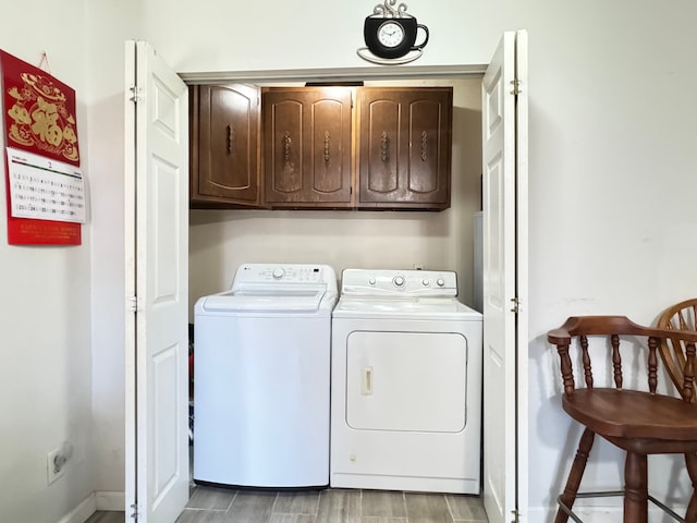 24275 Valley Ave, Eastpointe, MI 48021 - washroom with cabinet space and washing machine and clothes dryer