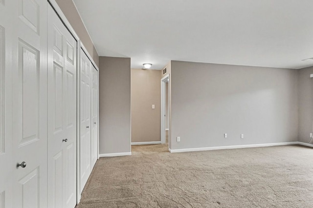 unfurnished bedroom featuring baseboards and carpet floors