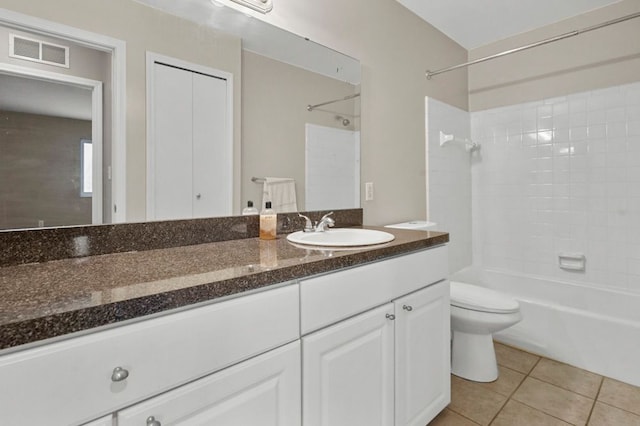 bathroom with tile patterned flooring, vanity, toilet, visible vents, and shower / tub combination