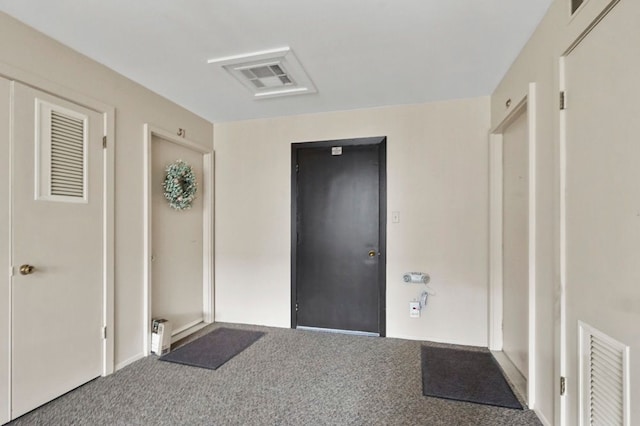carpeted entrance foyer featuring visible vents