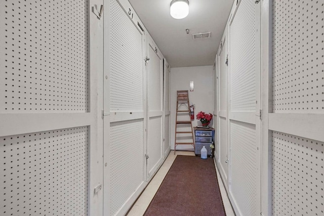 hall featuring visible vents