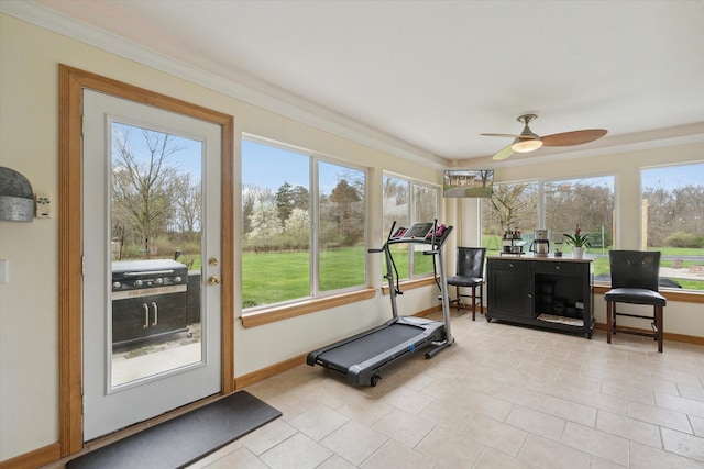 workout room featuring ceiling fan, baseboards, and light tile patterned floors
