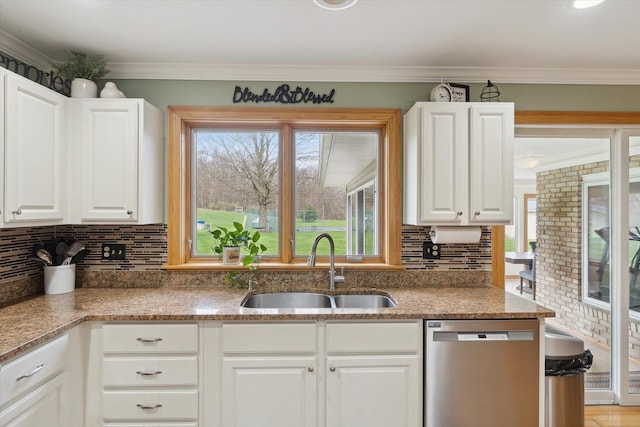 kitchen featuring crown molding, dishwasher, a sink, and white cabinetry