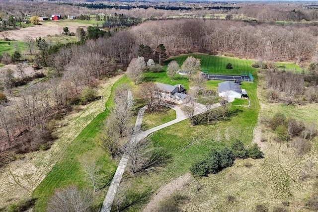 birds eye view of property with a rural view