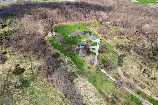aerial view featuring a wooded view