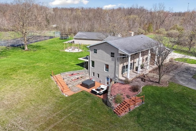 drone / aerial view featuring a forest view