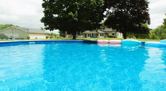view of swimming pool featuring an infinity pool