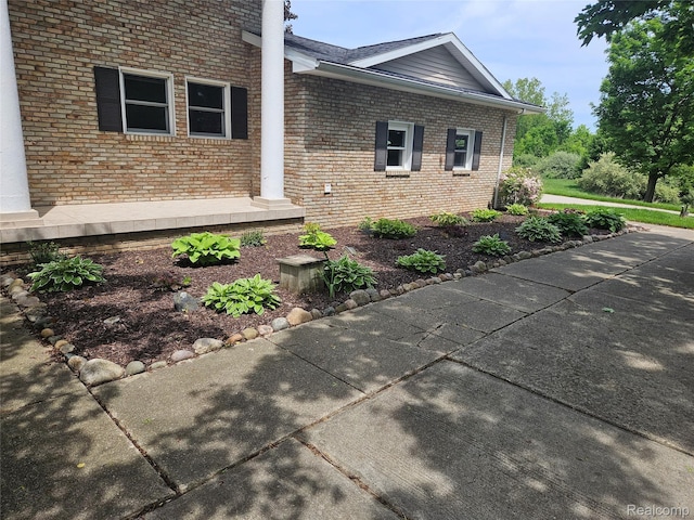 8114 Gale Rd, Goodrich, MI 48438 - view of home's exterior with brick siding