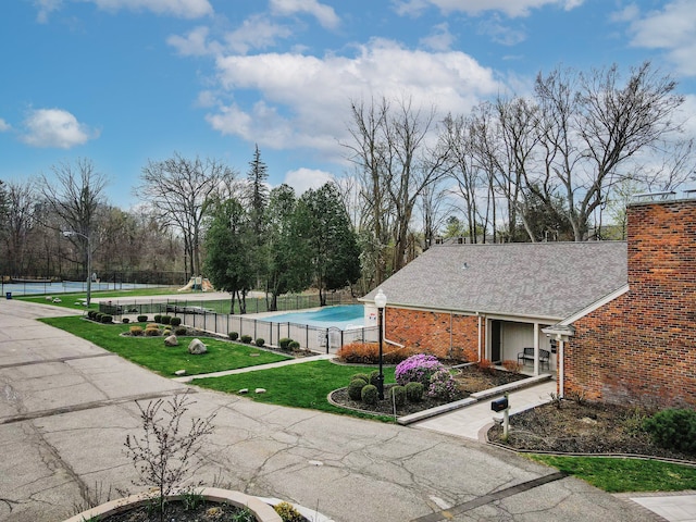 exterior space with a yard and fence