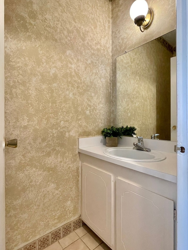 bathroom featuring wallpapered walls, tile patterned flooring, and vanity
