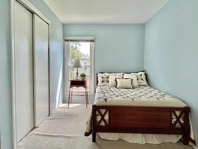bedroom featuring a closet and carpet floors