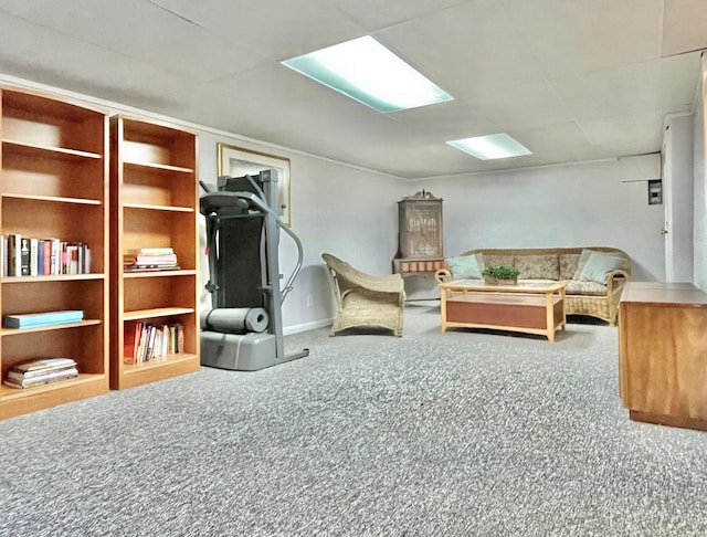 sitting room featuring carpet flooring and baseboards