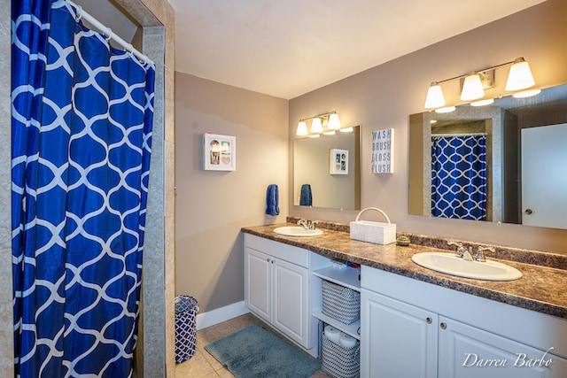 3770 Pine Ln, Saranac, MI 48881 - bathroom featuring double vanity, tile patterned floors, and a shower with curtain