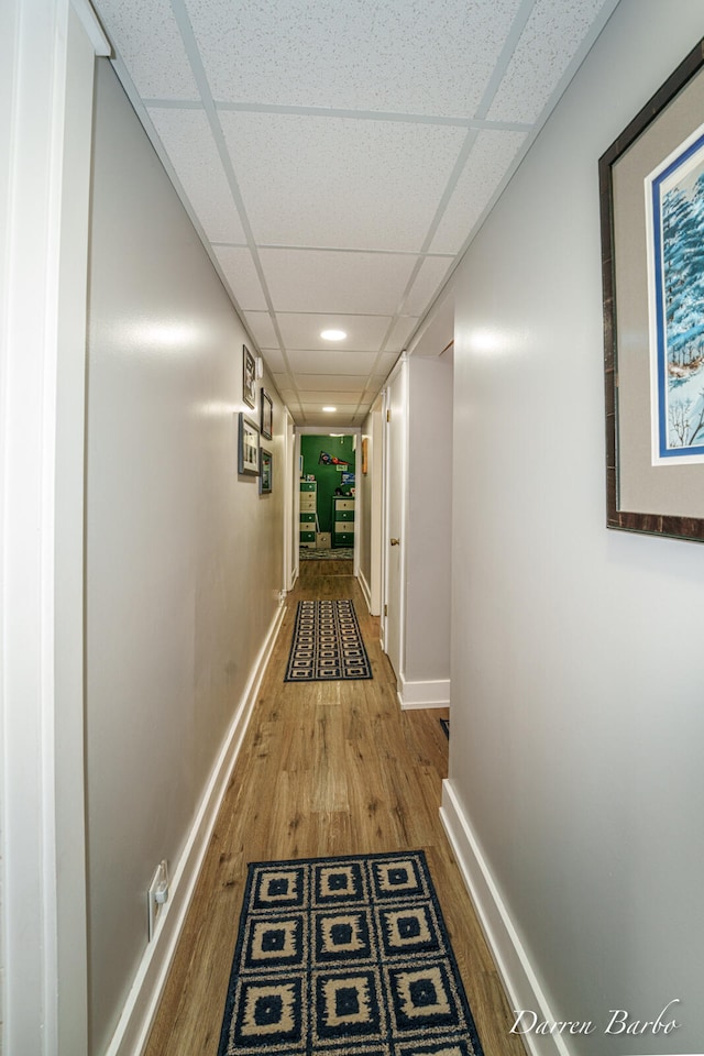 3770 Pine Ln, Saranac, MI 48881 - corridor featuring wood finished floors and a drop ceiling