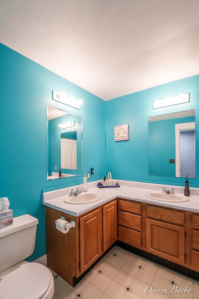 3770 Pine Ln, Saranac, MI 48881 - bathroom with double vanity and tile patterned flooring
