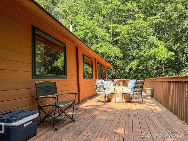 3770 Pine Ln, Saranac, MI 48881 - wooden deck featuring outdoor dining space