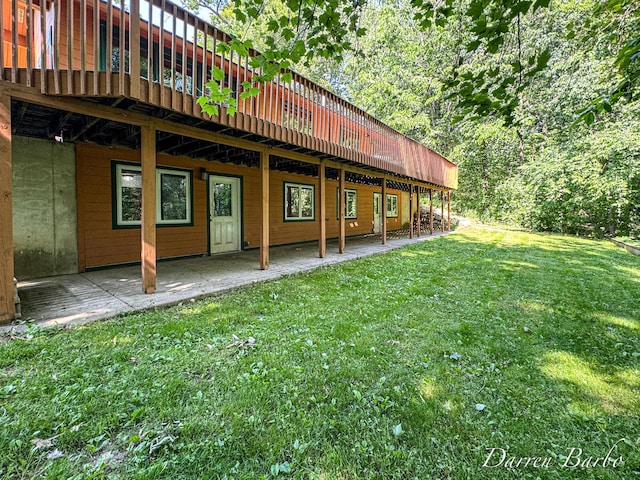 3770 Pine Ln, Saranac, MI 48881 - back of house with a lawn, a deck, and a patio