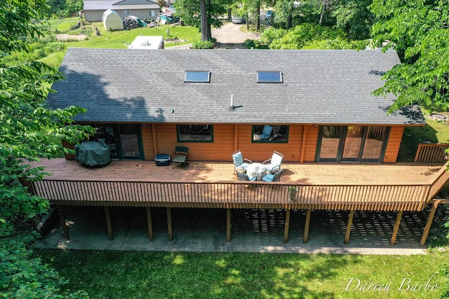 3770 Pine Ln, Saranac, MI 48881 - back of property with roof with shingles and a wooden deck
