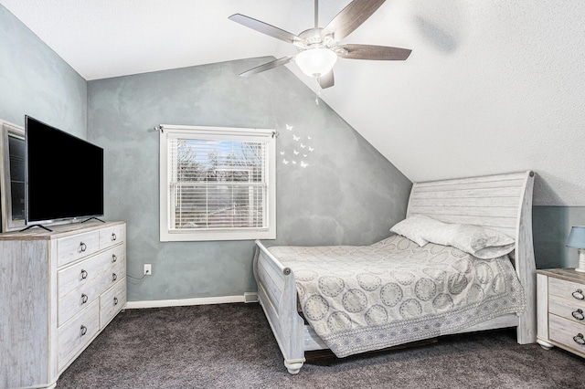 bedroom featuring baseboards, lofted ceiling, a ceiling fan, and dark colored carpet