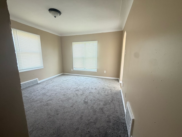 8909 Penrod St, Detroit, MI 48228 - carpeted spare room featuring visible vents, baseboards, and plenty of natural light