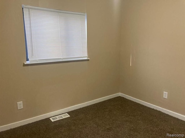 20442 Greenlawn St, Detroit, MI 48221 - spare room featuring baseboards, visible vents, and dark carpet