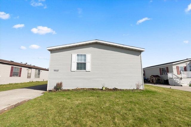 view of property exterior featuring a yard