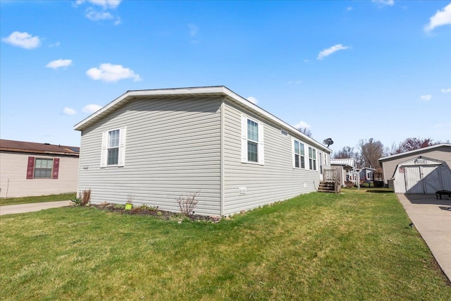view of side of home with an outdoor structure, a storage unit, and a yard