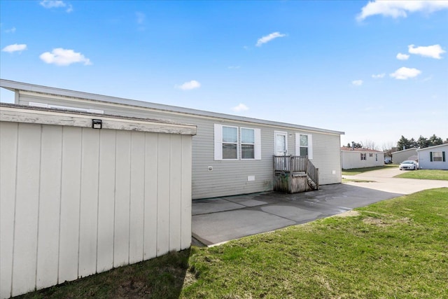 back of house with a yard