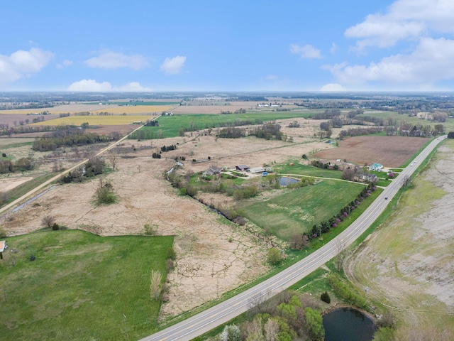 drone / aerial view featuring a rural view and a water view